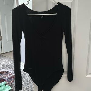 Black v-neck long sleeve body suit, size M